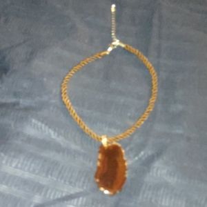Braided silk necklace with polished amber.